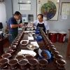 Coffee quality cupping taste test performed by producers at Sol y Cafe in Peru.