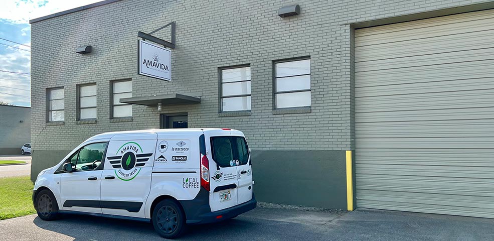 Amavida Coffee and Trading Company Birmingham, AL wholesale warehouse with delivery van.